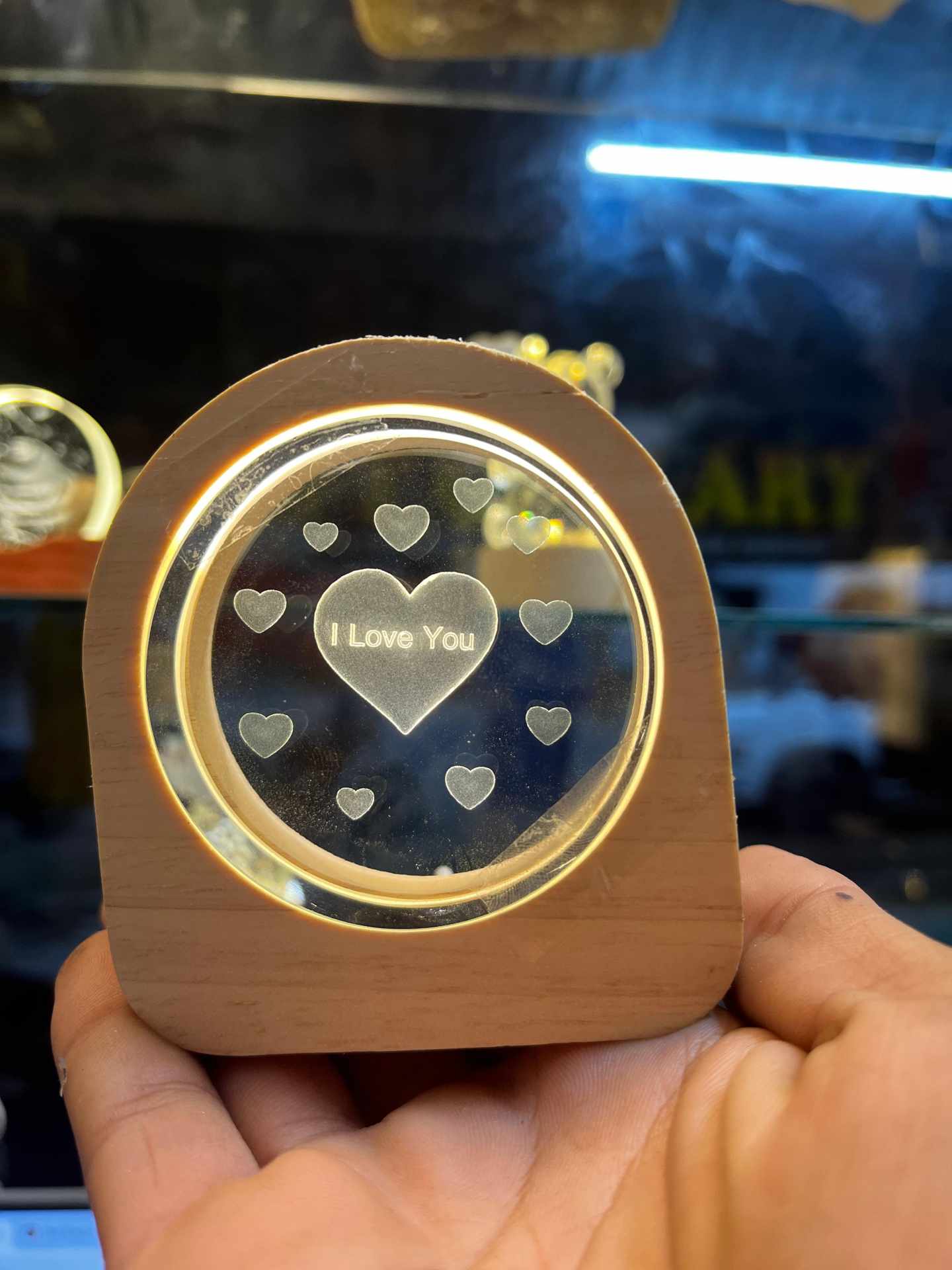 3D Love Heart Crystal Ball Night Lamp with a wooden base.